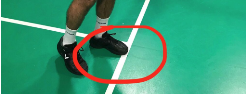 Your feet must not be touching any of the court lines